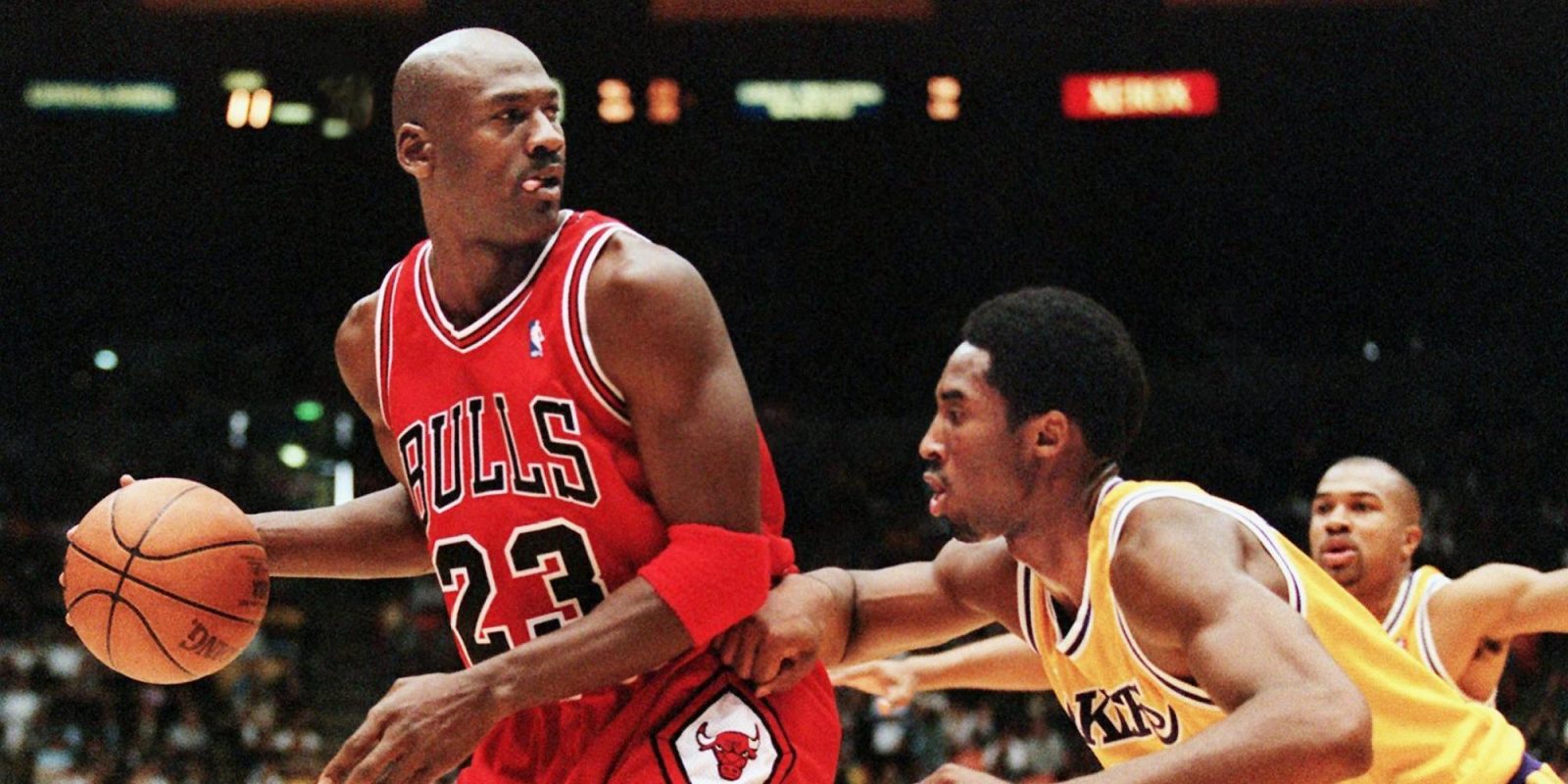 Michael Jordan of the Chicago Bulls (L) eyes the b
