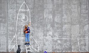 20160505175639-self-motivated-boy-drawing-rocket-chalk-dog